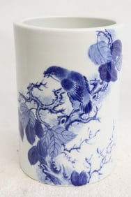 A blue and white porcelain brush holder