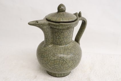 A celadon crackleware porcelain wine server
