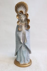 A signed terracotta sculpture of Madonna