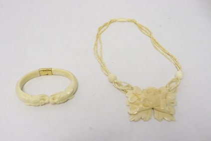 2 bone like carved jewelry pieces