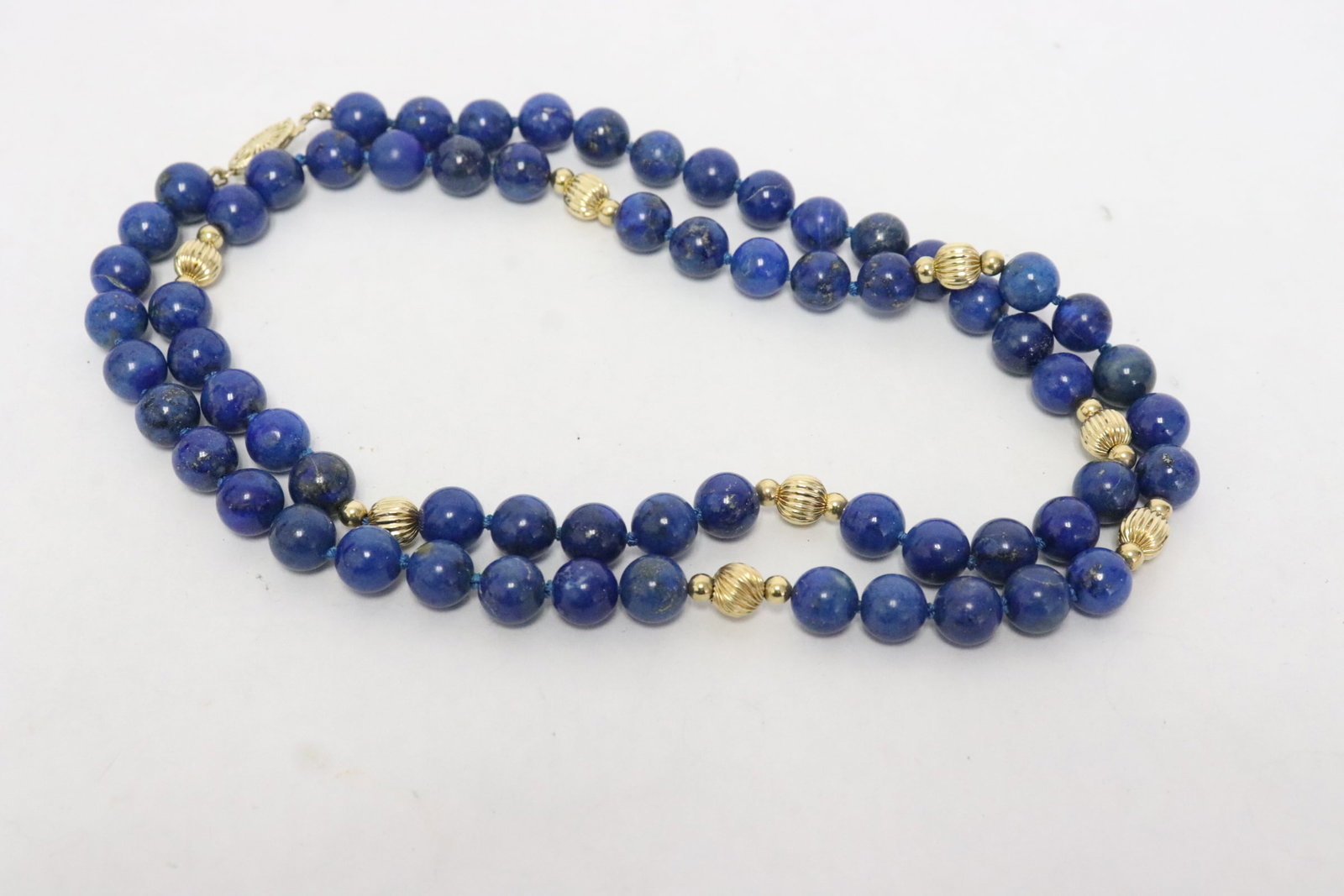 Lapis bead and 14K Y/G bead necklace: Lapis bead and 14K Y/G bead necklace; lapis bead measures approx. 9.0mm diameter, and 14K Y/G bead measures approx. 7.0mm diameter, total eight 14K Y/G beads with 14K Y/G clasps