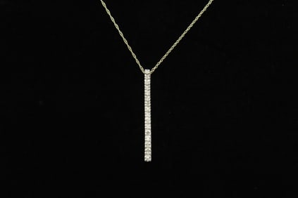 A 14K Y/G diamond pendant w/ 14K Y/G necklace