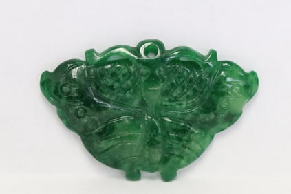 A translucent emerald green jadeite carving