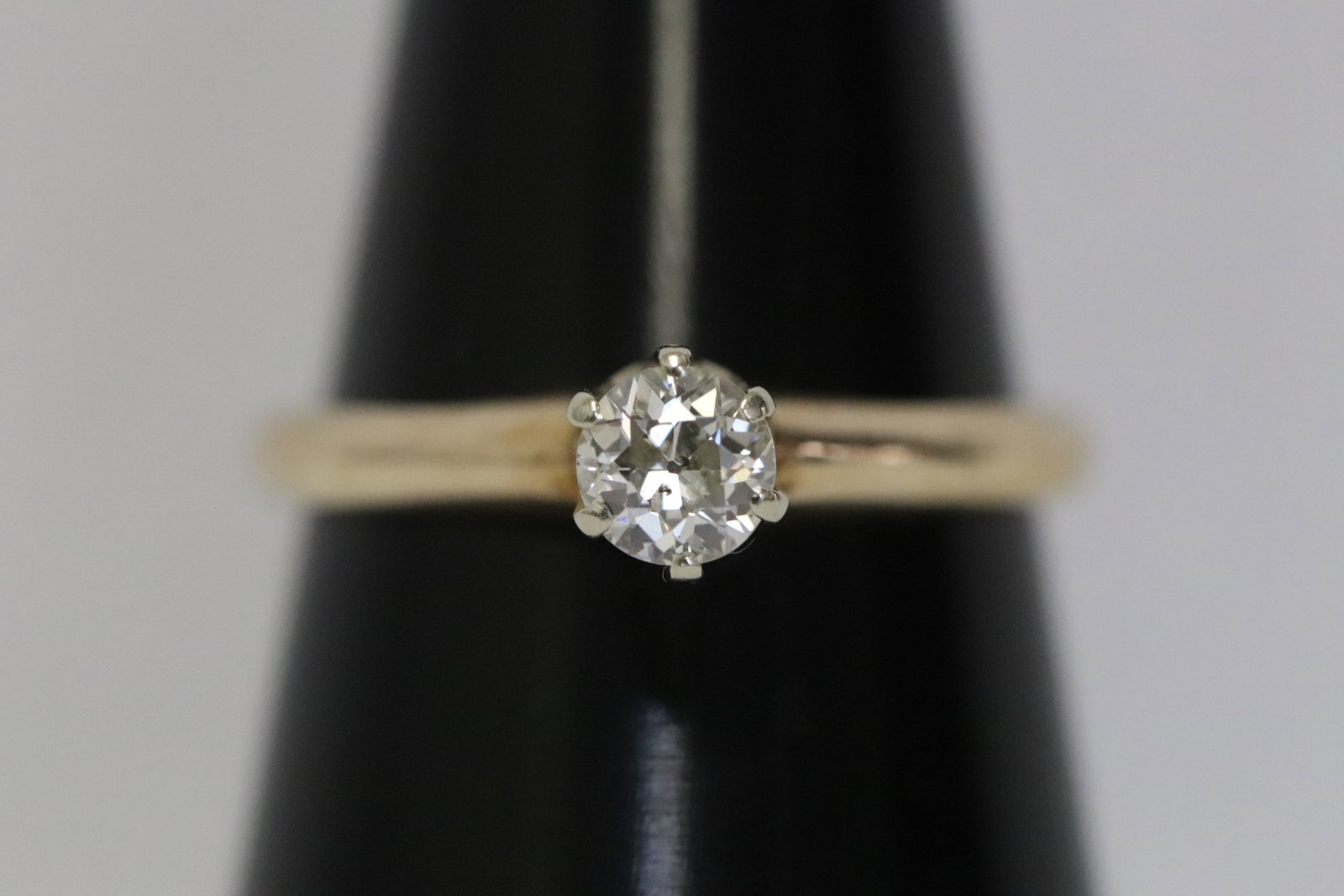 A 14K Y/G diamond ring: A 14K Y/G ring set with an European cut diamond wt. approx. 0.30ct, wt. 2.4gm, size 6.5