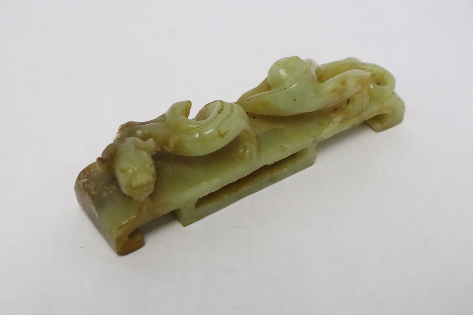 A celadon jade carved dragon belt buckle (1 of 8)
