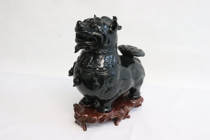 A dark green jade like stone carved censer
