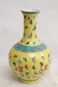 A yellow background famille rose porcelain vase
