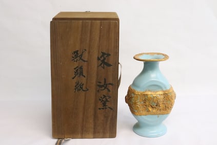 A gold on blue porcelain vase