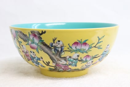 A large yellow background famille rose bowl