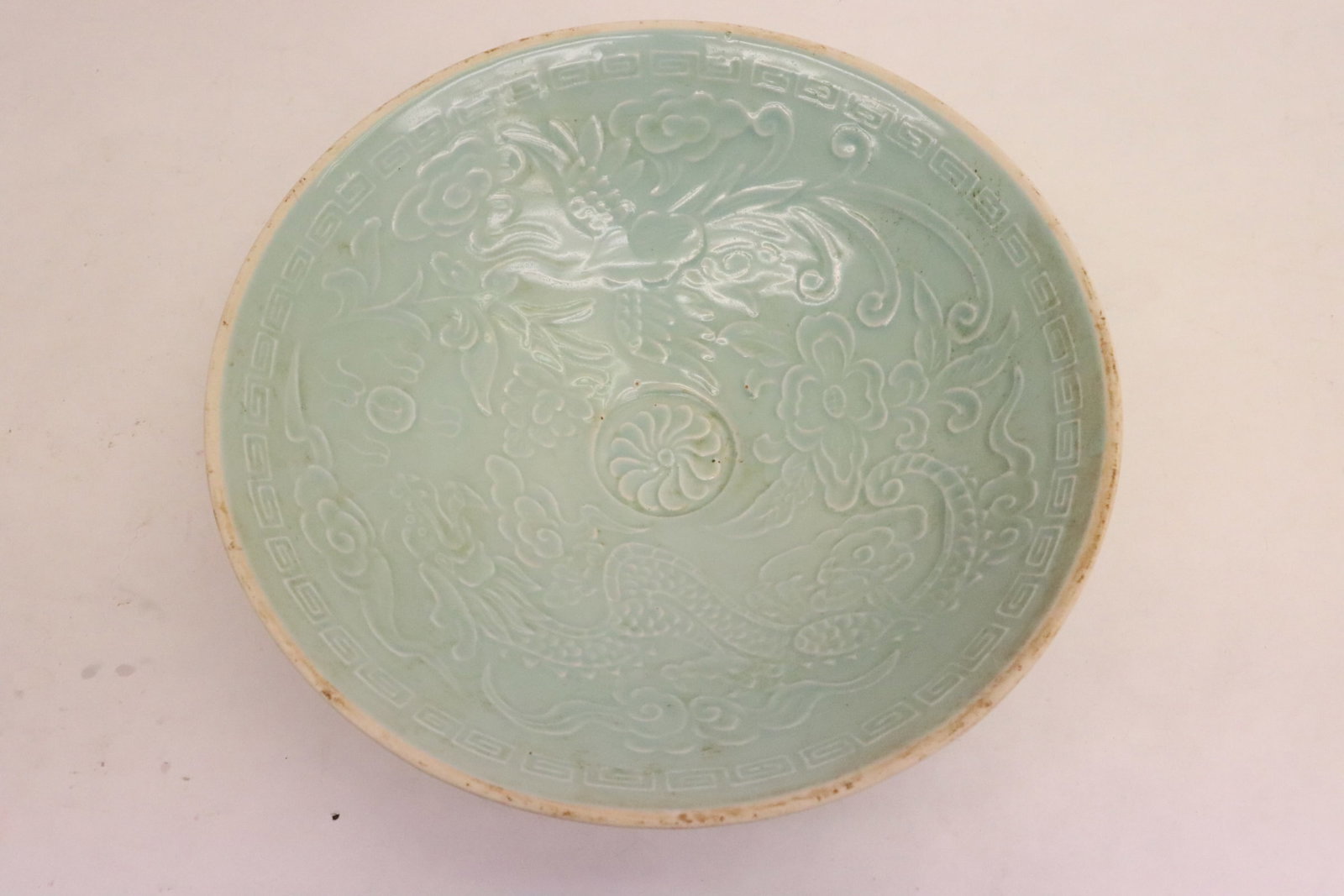 Light blue Song style bowl: Light blue Song style bowl embossed with dragon motif decoration, 2.35"x8"dia