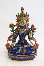 An enamel on brass sculpture of deity