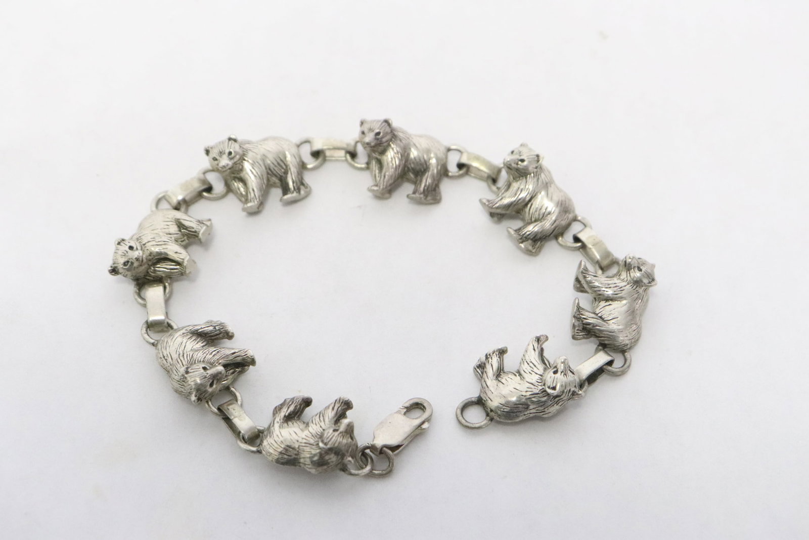 A charm bracelet with bear motif charms: An interesting charm bracelet with bear motif charms, 7.6"L