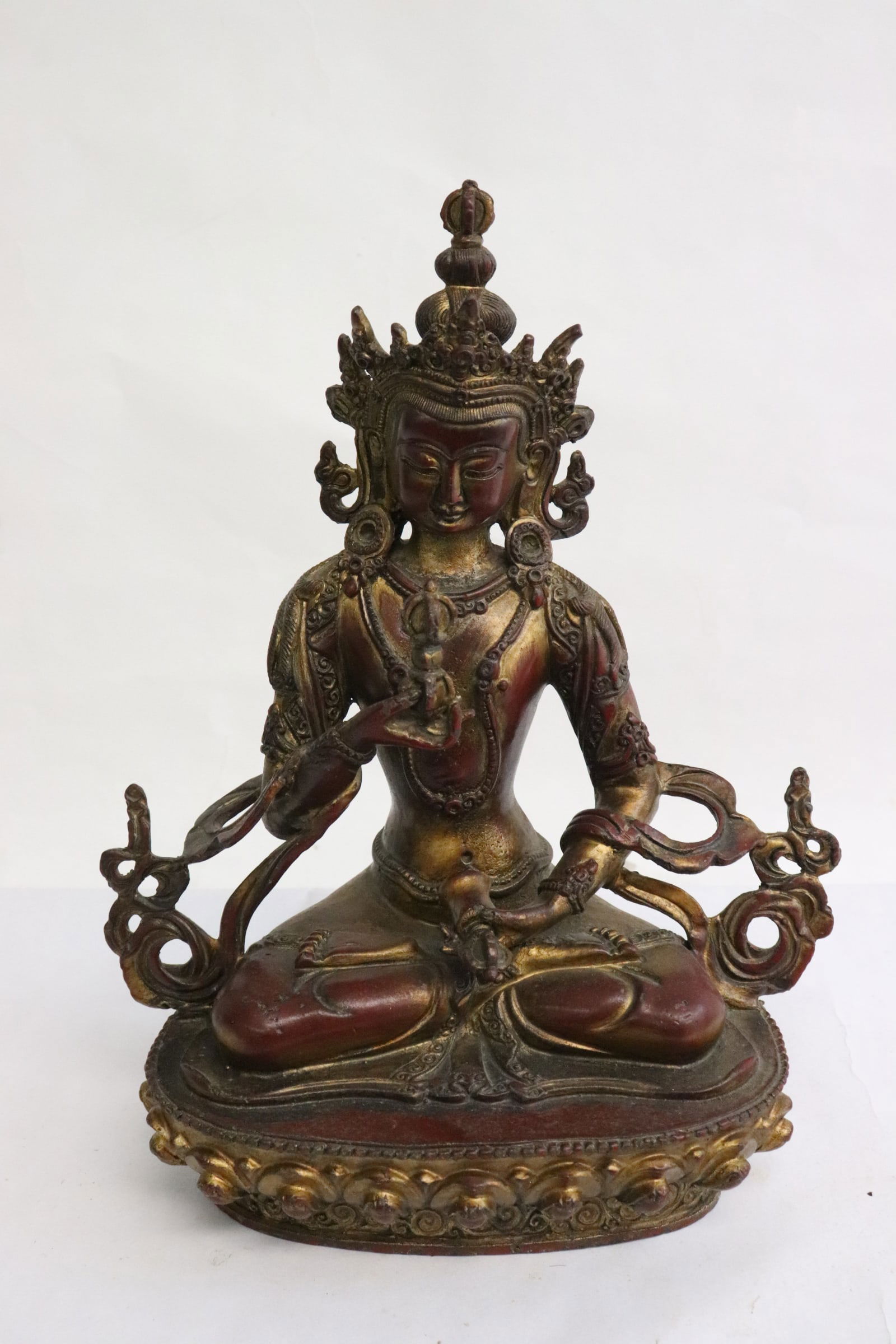 A copper/ bronze sculpture of deity (1 of 8)