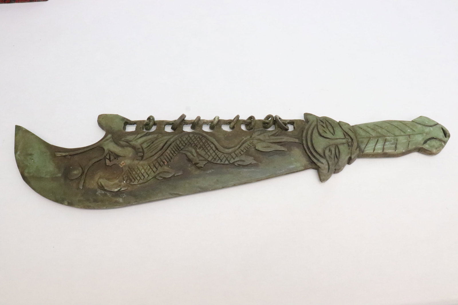 A stone carved sword: A stone carved sword, 19.3"L