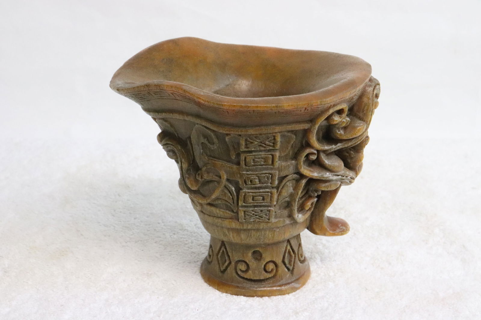 A simulated horn carved libation cup (1 of 8)