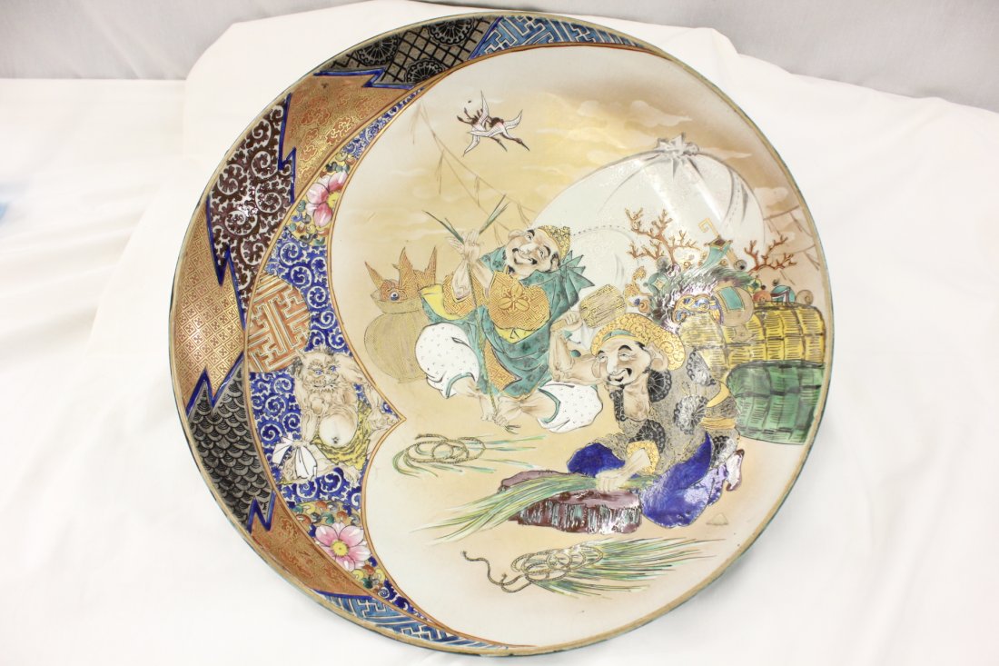 Antique Japanese kutani charger: Antique Japanese kutani charger painted with 2 monks and oni, 2.5"Hx15.7:"dia