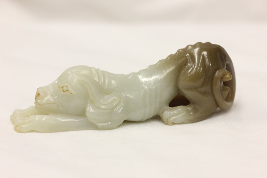 Chinese white and brown jade carved dog: Chinese white and brown jade carved dog, 3"Lx0.7"x1"