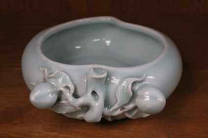 A light blue porcelain brush wash w/ pressed mark