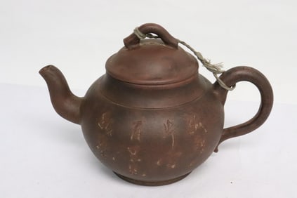 Chinese Yixing teapot with incised calligraphy