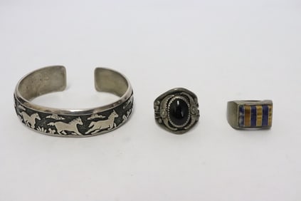 2 sterling rings, & a sterling bangle signed Te Singer