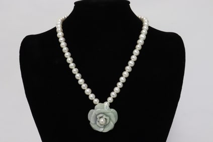 Cultured pearl necklace w/ a jadeite carved flower