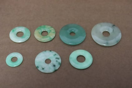 7 vintage jadeite carved discs