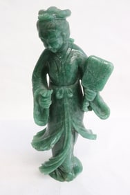 A green jade like stone carved Guanyin