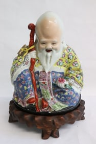 Chinese antique famille rose sculpture of deity w/ stand