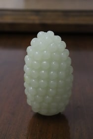 A jade like stone carved grape fruit