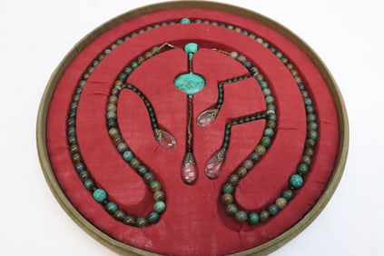 A long necklace with embroidery style box