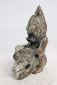 Large jade like stone carved deity