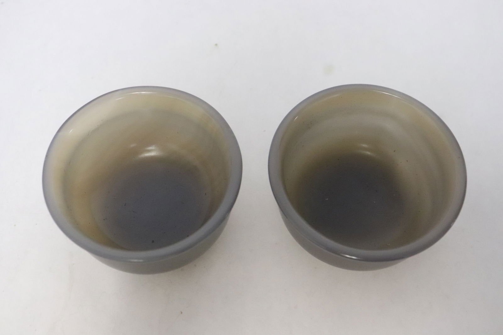 2 agate like stone carved wine cups: 2 agate like stone carved wine cups, 1.25"x2.2"dia ea