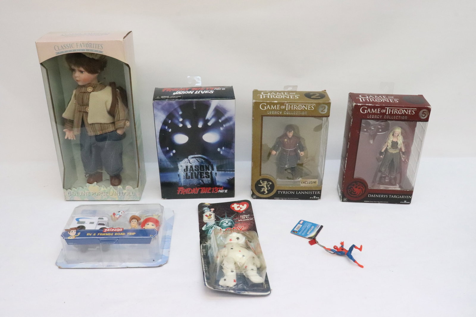 5 doll/ figures: 5 doll/ figures (3.85"H - 12.8"H); 2 Game of Thrones figures, one Friday the Thirteen VI figure, one Toy Story RV set, and classic favorite porcelain hand doll