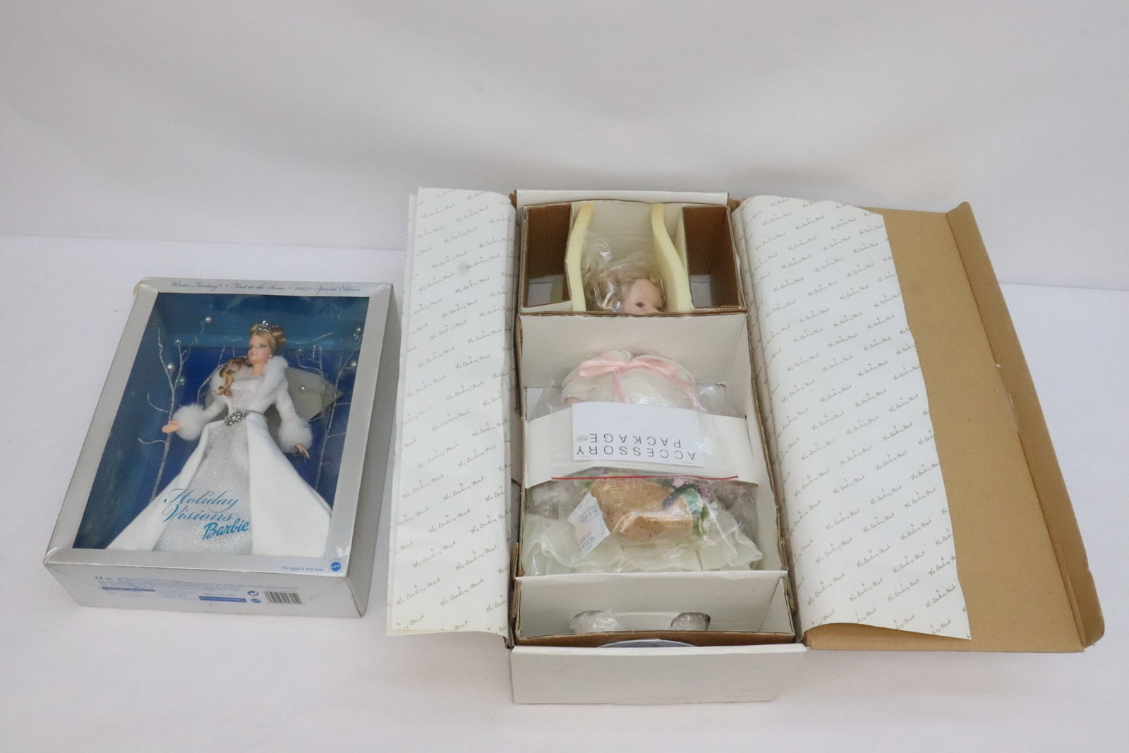 2 dolls: 2 dolls (13.2"H, 17.5"H); a Barbie holiday vidion doll, and a Shirley Temple flower girl doll