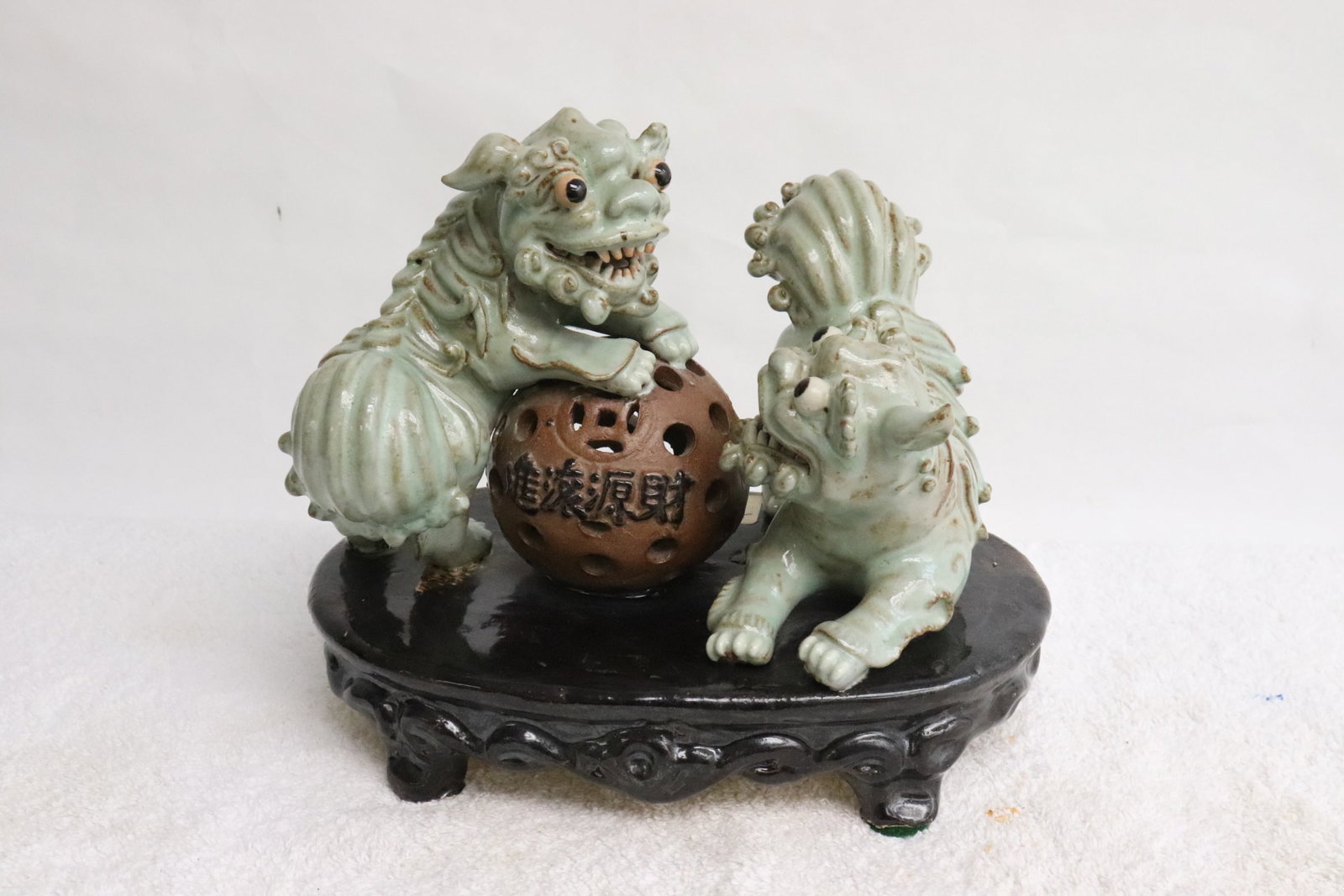 Pair earthenware sancai fulions with ball: Pair earthenware sancai fulions with ball, one earthenware stand, one ear of fulion missing, 6.8"H