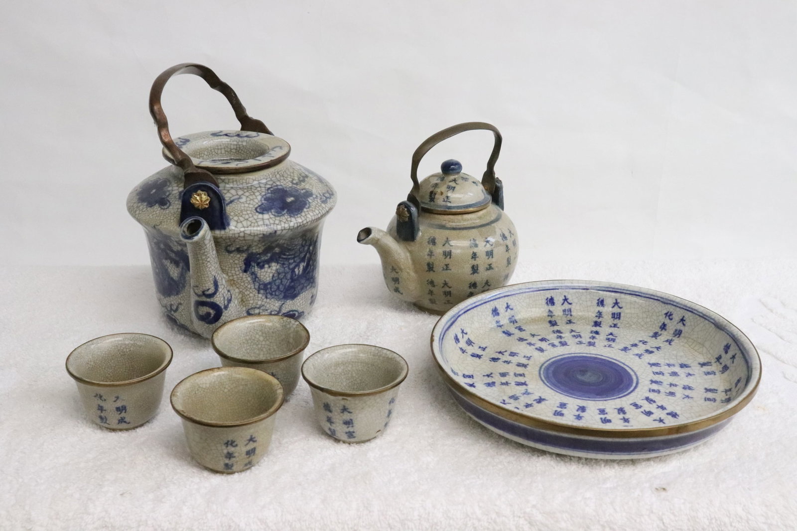 7 pc Chinese porcelain crackleware porcelain tea set: 7 pieces Chinese blue and white porcelain crackleware porcelain tea set, 1.6"x2.2"dia - 4.7"x6.6"x5.3"