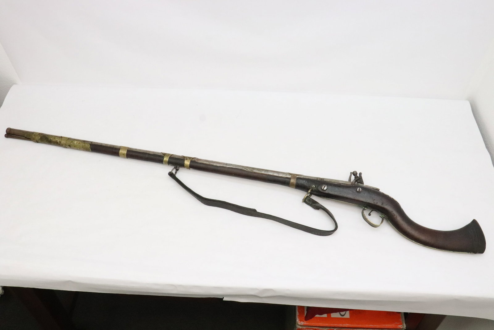 early 19th c. European flintlock rifle dated 1810: An early 19th century European flintlock rifle dated 1810, the wood on barrel has cracks, we do not know if it functions, 55.8"L