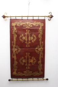 A leather wall hanging panel w/ 2 gilt metal bars