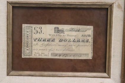 A framed Confederate 3-dollar banknotes