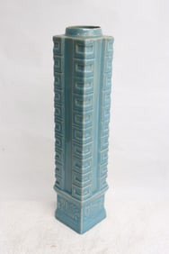 A tall blue glazed porcelain vase