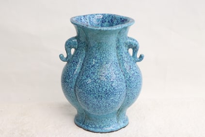 A blue glazed porcelain handled vase