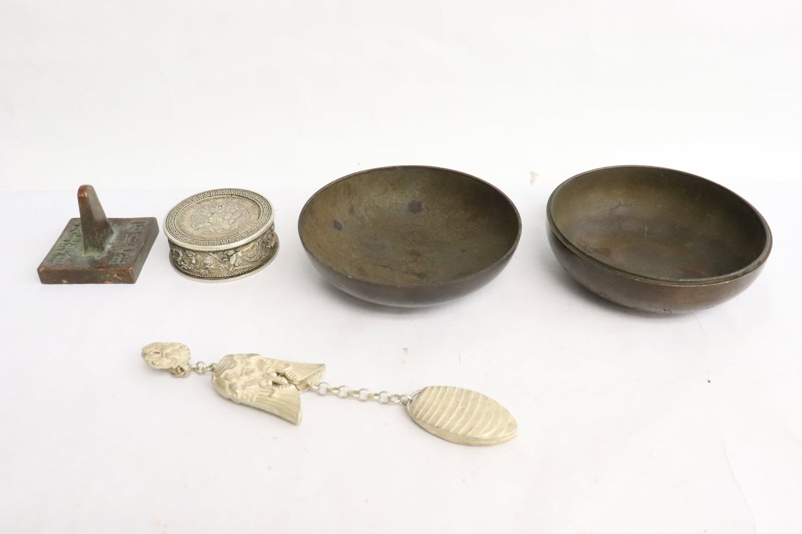 4 items: 4 items; white bronze box (0.75"x2"dia), white metal ornament (6"L), bronze seal (1.4"x1.7"x1.7"), and a bronze ink box (2.2"x3.75"dia)