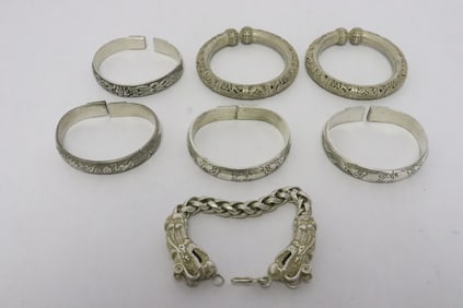 7 white metal bracelets/ bangles