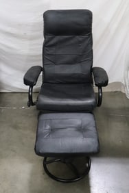 A black leather chair with ottoman