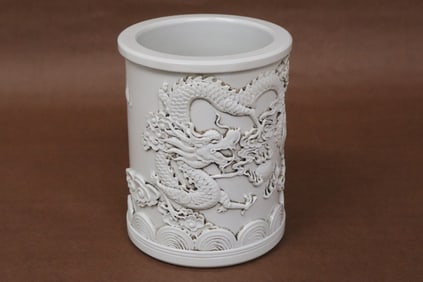 A white porcelain brush holder
