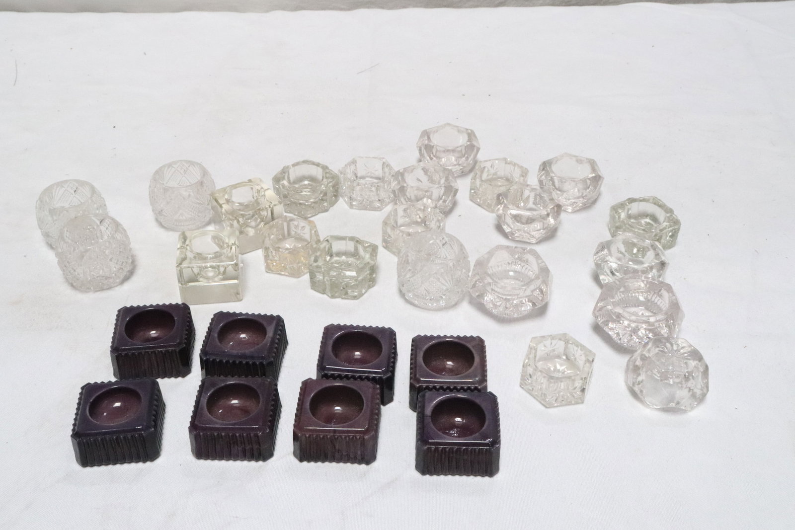 Approx. 28 crystal/ chocolate glass salt/ candle holders: Approx. 28 crystal/ chocolate glass salt/ candle holders