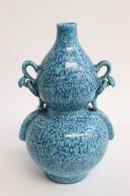 A blue glazed porcelain gourd shape handled vase