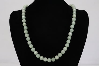 A jadeite bead necklace