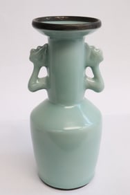 A celadon porcelain handled vase