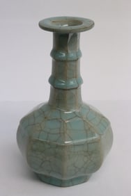 An octagonal light blue crackleware porcelain vase